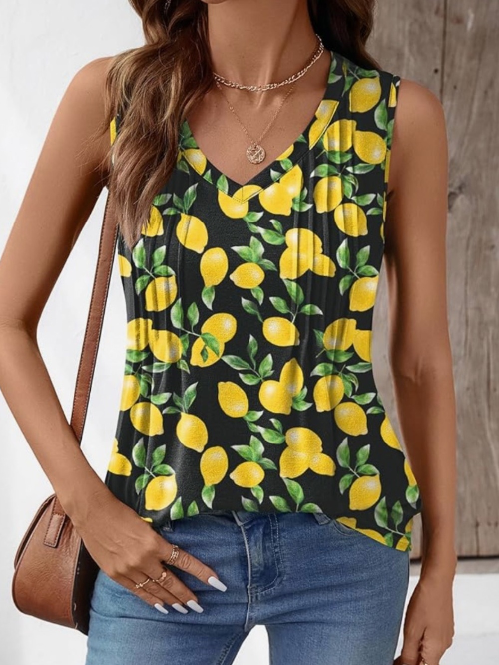Fresh lemon print sleeveless V-neck top in black and yellow. Lightweight, breath